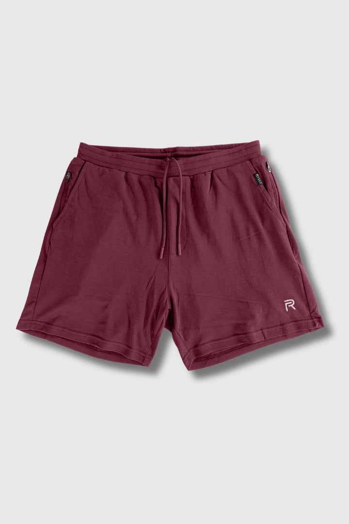 A single green leaf against a white background.