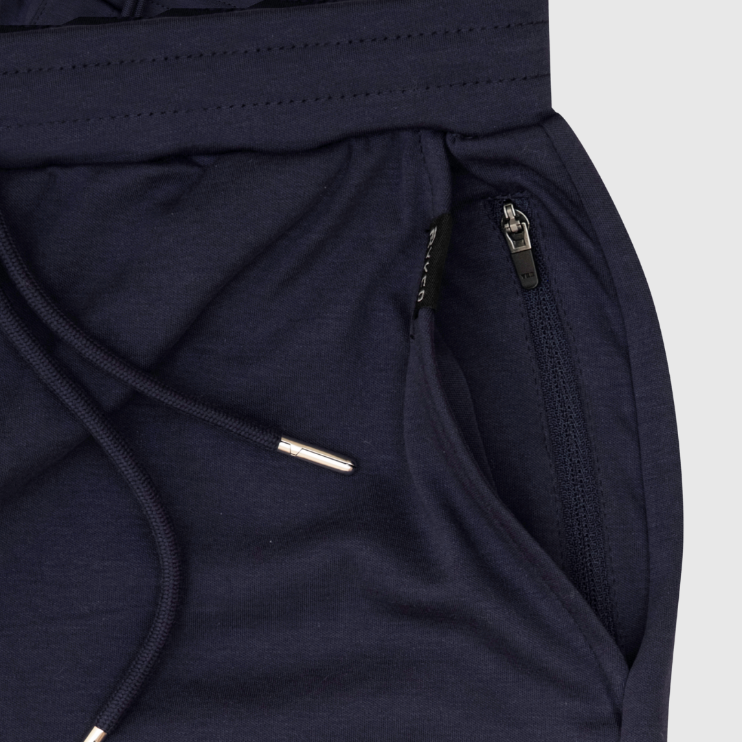 A single green leaf against a white background.