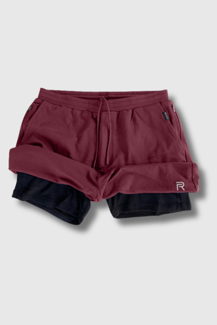 A single green leaf against a white background.