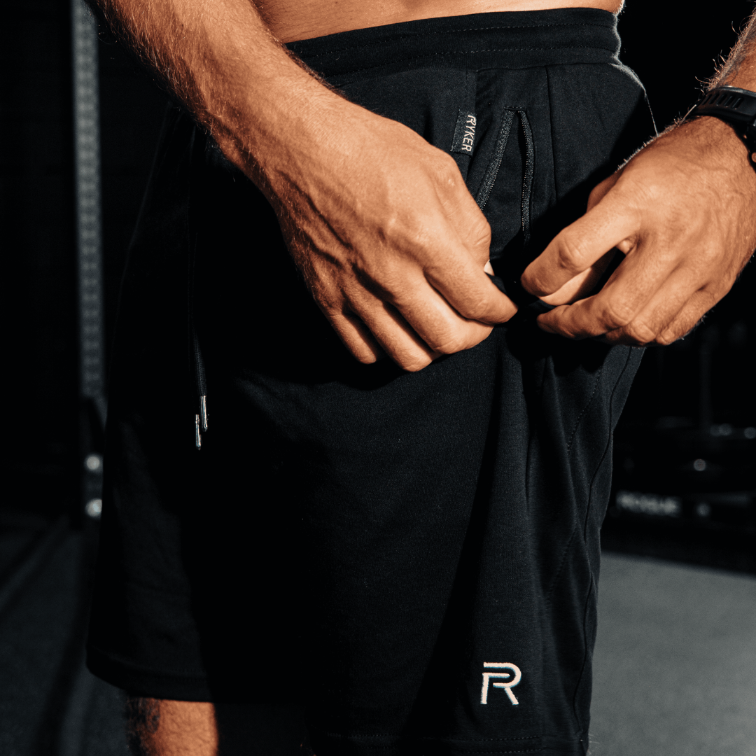 A single green leaf against a white background.